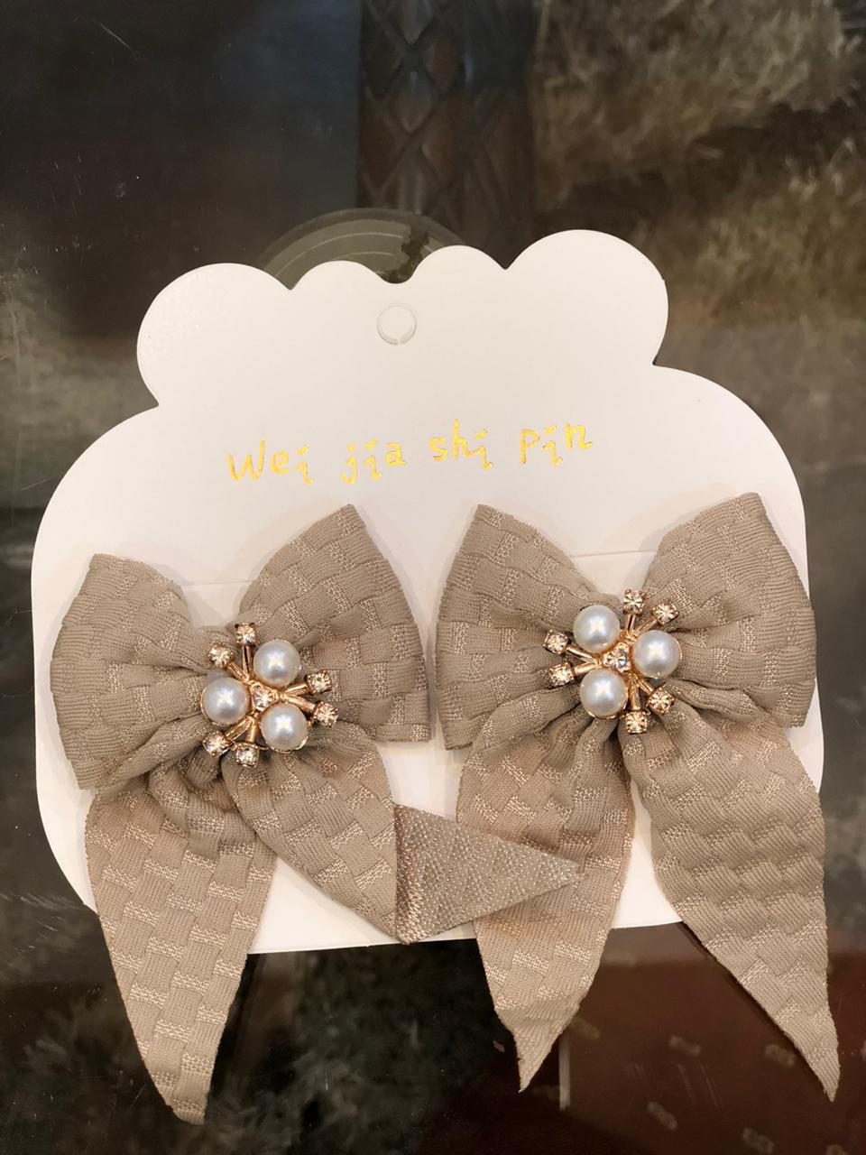 pair of bow hair clips with faux pearl